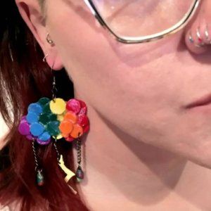 Multiple pairs of varied colored cloud earrings